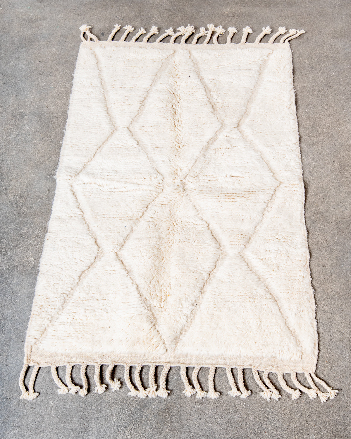 Modern, designer, handcrafted Berber rug from Morocco. Beniourain carpet with minimalist design, natural wool pile and a fluffy texture.